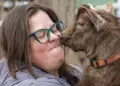 Kate Fisher holds her Nigerian Dwarf goat, Steve.
