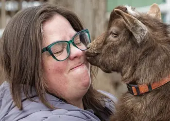 Kate Fisher holds her Nigerian Dwarf goat, Steve.