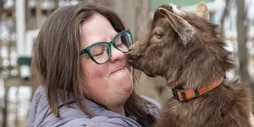 Kate Fisher holds her Nigerian Dwarf goat, Steve.