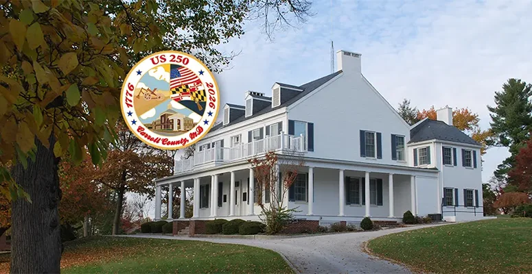 Large white historic house with a wraparound porch on a curved driveway, autumn trees, and an overlaid circular US 250 commemorative seal.