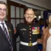 Jason-Sidock-Sgt-Maj-Jason-Kappen Corynne Courpas - Carroll News | Carroll Publications | Carroll County, MD Three smiling adults at a formal event: a Marine in dress uniform with medals flanked by a man in a suit and a woman in a tan jacket nearby.