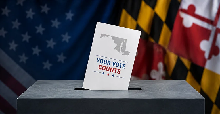 Ballot being dropped into a ballot box with a 'Your Vote Counts' card, patriotic flags in the background.