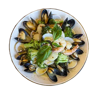 Seafood Primavera_1 - Carroll News | Carroll Publications | Carroll County, MD Bowl of seafood pasta with mussels, clams, shrimp, lemon wedges, and fresh basil.
