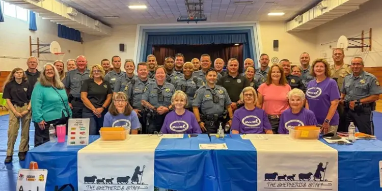 - Carroll News | Carroll Publications | Carroll County, MD Group photo of sheriff's deputies and volunteers at a community event behind a table with The Shepherd's Staff banners in a gym setting